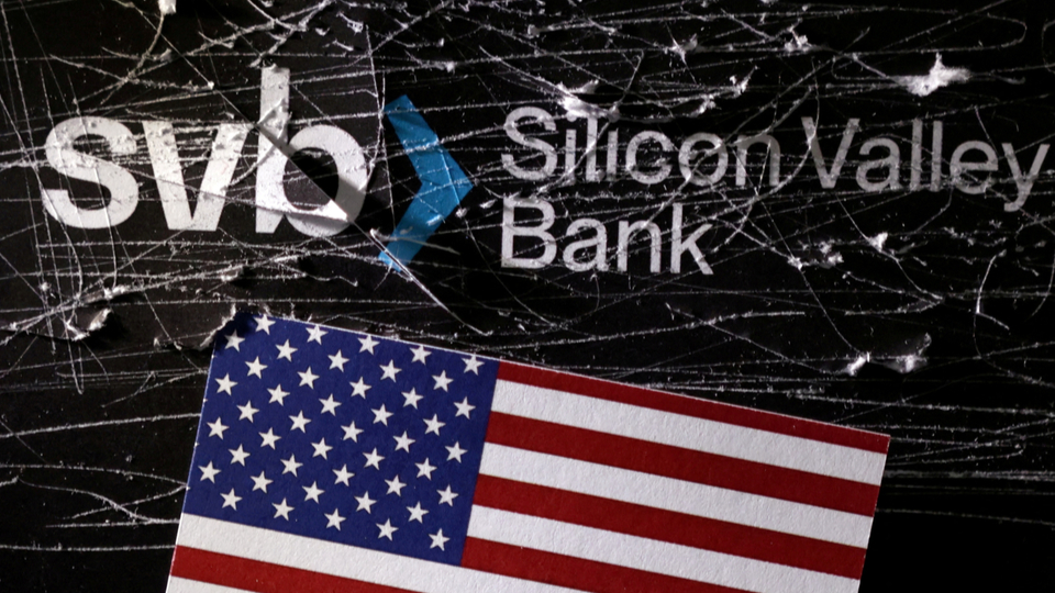 Illustration shows destroyed SVB (Silicon Valley Bank) logo and U.S. flag