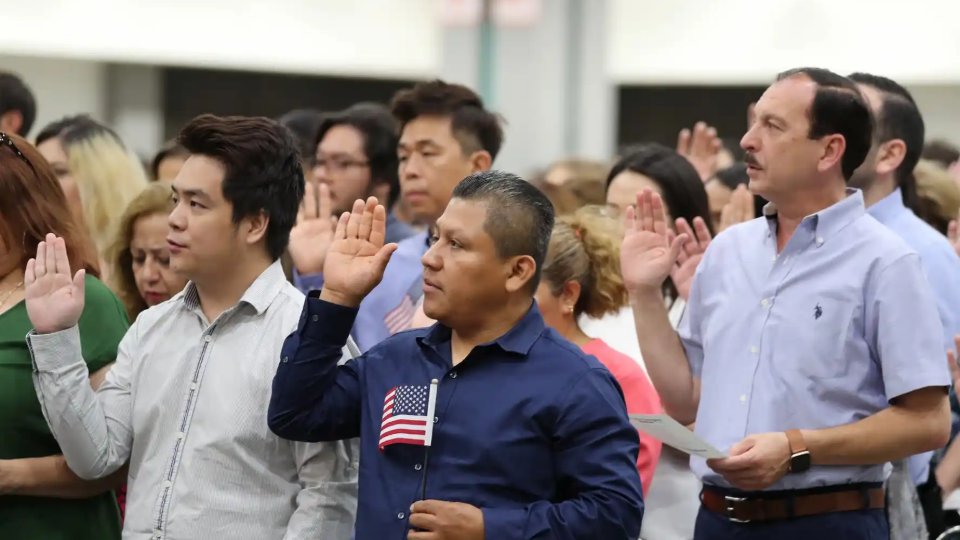 Immigrants are sworn in as new U.S. citizens at a naturalization ceremony in Los Angeles