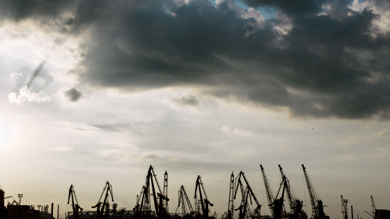 Industrial port cranes against the backdrop of storm clouds in Odessa