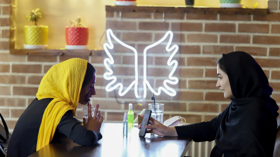 Iranian women sit in a cafe