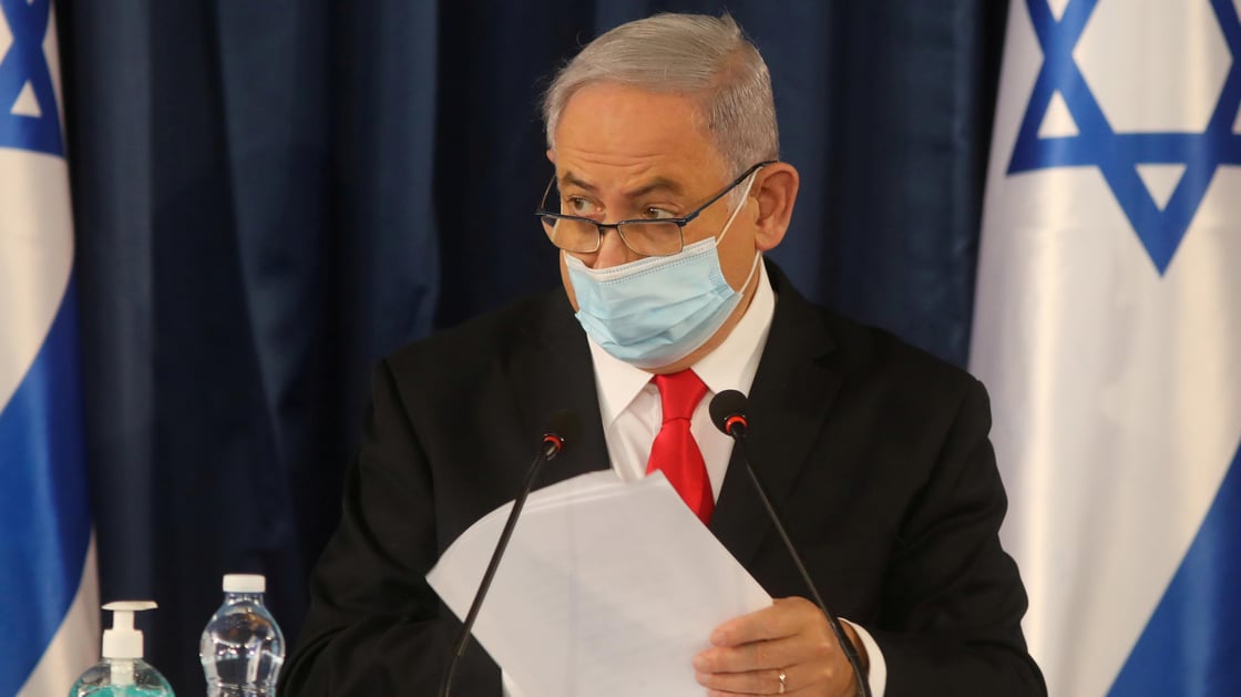 Israeli Prime Minister Benjamin Netanyahu, wearing a protective mask due to the ongoing coronavirus disease