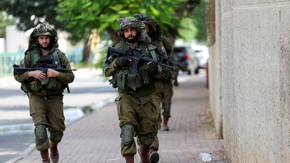 Israeli soldiers patrol following a mass-infiltration by Hamas gunmen from the Gaza Strip