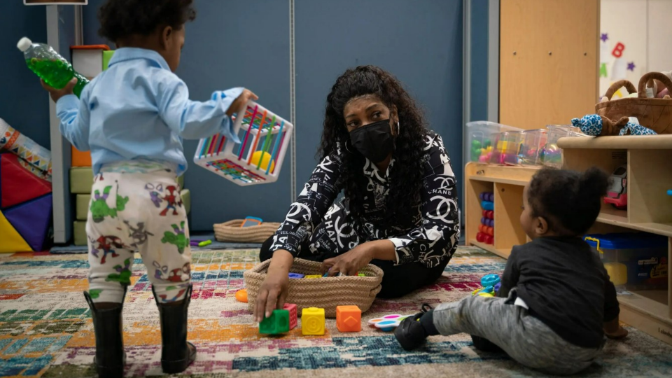 Jacqueline Fordham watches over children at the Cribs2College Academy child care center in Detroit