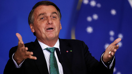 Jair Bolsonaro gestures during a ceremony by the National Program of Civic-Military Schools