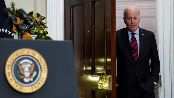 Joe Biden prepares to walk into room at the White House