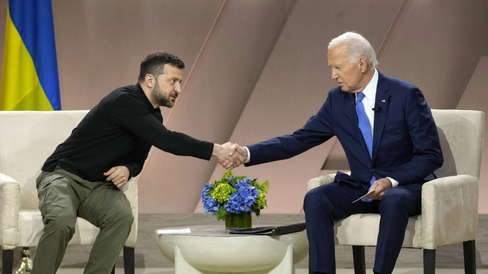 Joe Biden shakes hands with Volodymyr Zelenskyy as he holds a bilateral meeting at the Walter E. Washington Convention Center