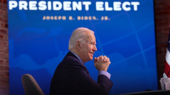 Joe Biden smiles during a national security conference video call