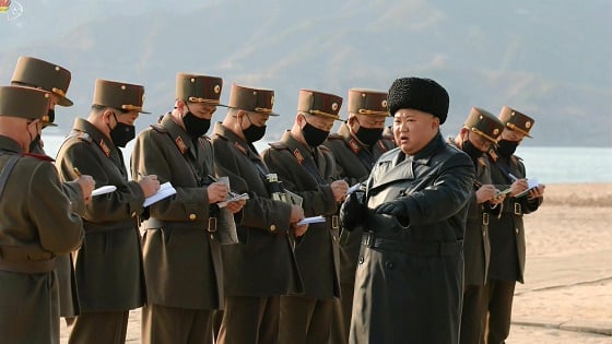 Kim Jong Un with masked soldiers