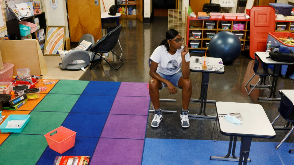 Kindergarten teacher Princess Bryant prepares her classroom for students who will be required to wear masks because of COVID19