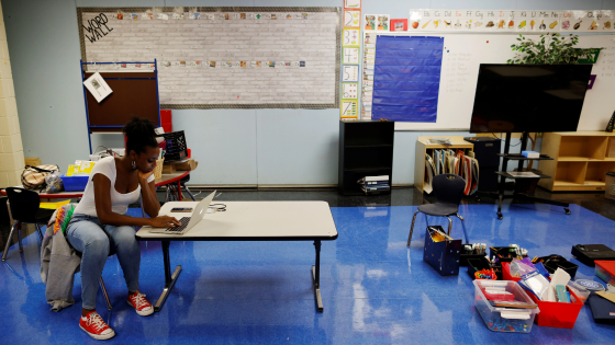 Kindergarten teacher Princess Bryant prepares her classroom from where she will begin the new school year teaching classes virtually