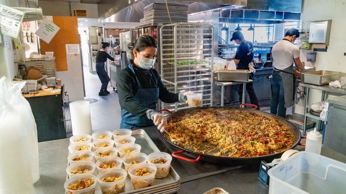 Kitchen staff preparing meals for frontline workers at Pagu in Cambridge