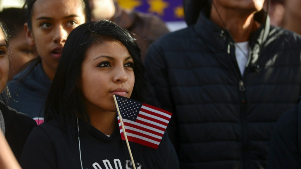 Latino leaders and immigration reform supporters gather at Farrand Field on the campus of the University of Colorado