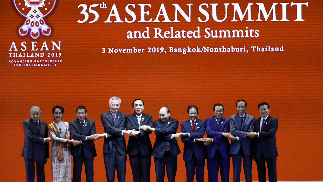 Leaders of the Association of Southeast Asian Nations shake hands at the Opening Ceremony of the 35th ASEAN Summit in Bangkok