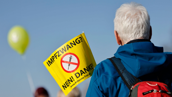 Man participates in antivaccination protest in Germany