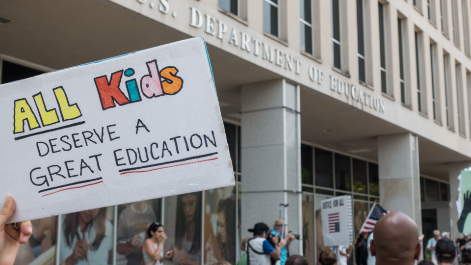 Marchers in National March for Public Education march to Department of Education Building protesting cuts in federal funds and the expanding private-school vouchers