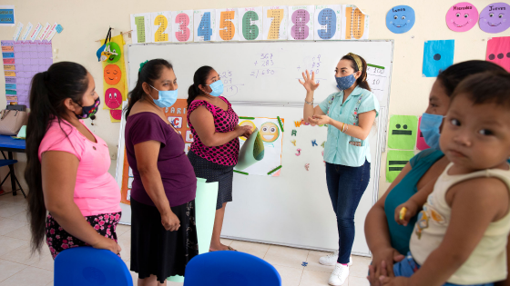 Mary Carmen Che Chi meets with the mothers of her pupils