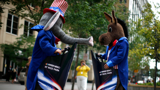 Mascots representing the Republican party and the Democratic party ride around on Segway personal transporters