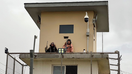 Members of the Taliban sit atop security tower in Kabul