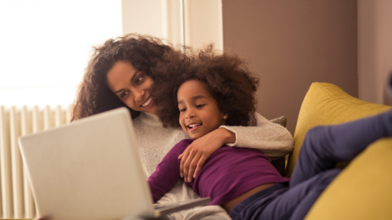 Mother and child using laptop computer