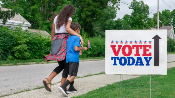 Mother and son walk to polling station