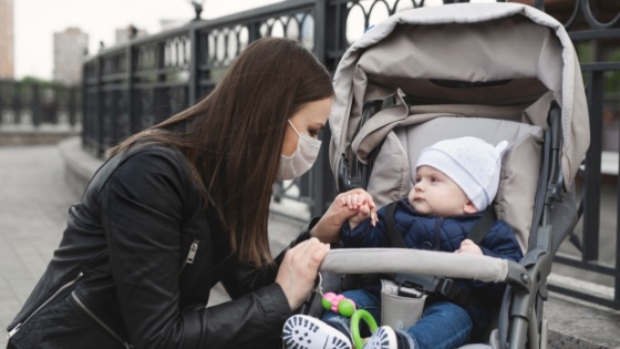 Mother in mask with her child