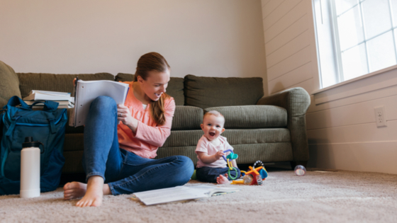 Mother studying with child.