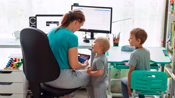 Mother working with two children