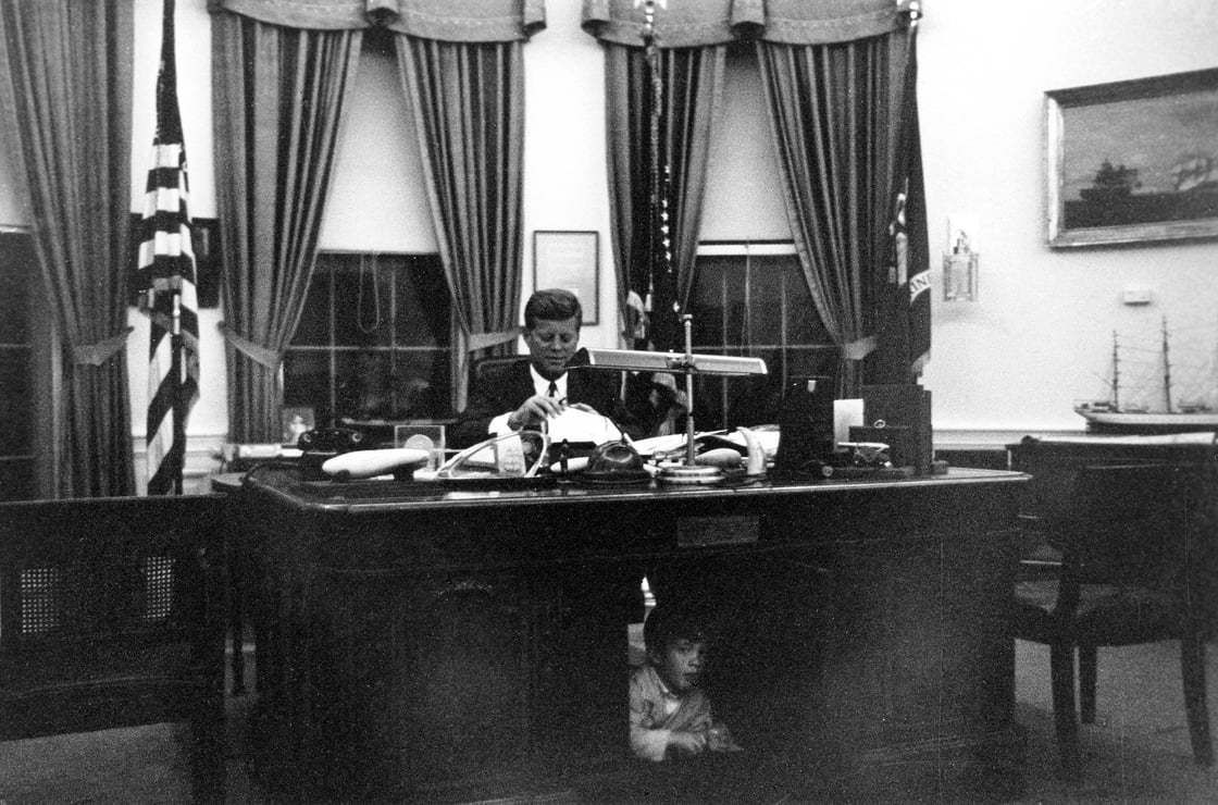 File handout image shows former U.S. President Kennedy at his White House Oval Office desk
