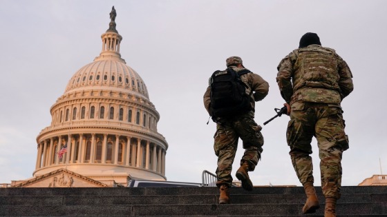 National Guard members walk at the Capitol