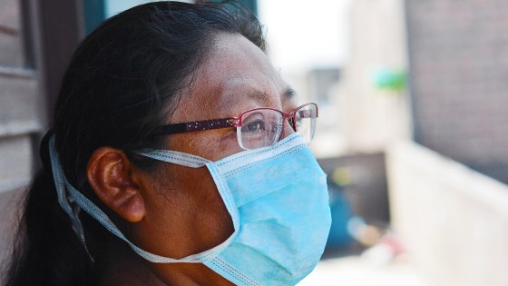 Native American woman wears protective mask