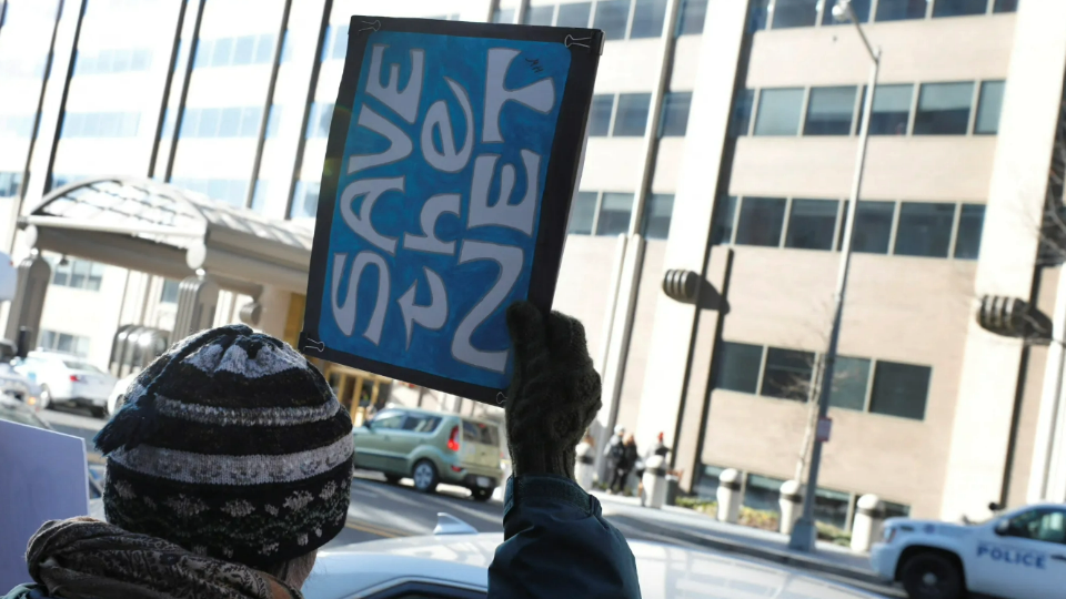 Net neutrality advocates rally in front of the Federal Communications Commission