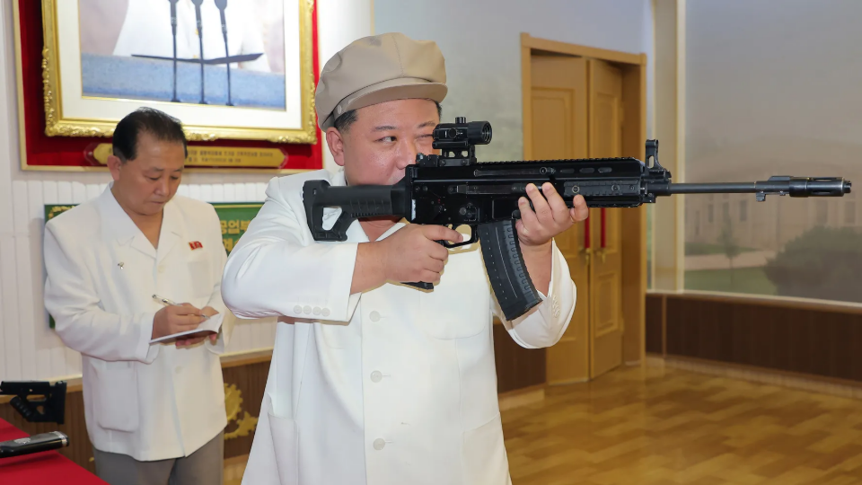 North Korean leader Kim Jong Un gives an orientation in a weapons factory