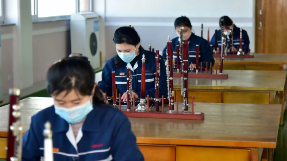 North Korean workers working in a factory of indigenous musical instruments in Pyongyang