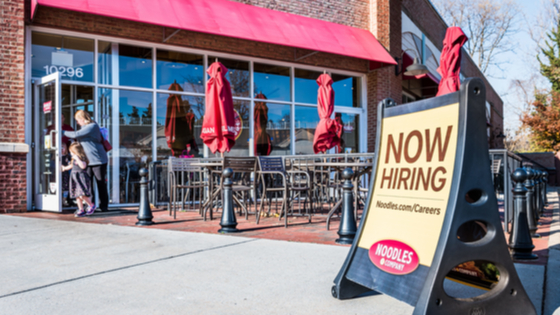 Now hiring sign outside Noodles & Company