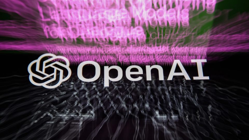 OpenAI logo displayed on a phone screen and OpenAI ChatGPT website displayed on a laptop screen