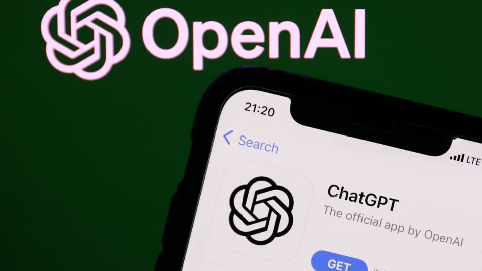 OpenAI logo on the website displayed on a phone screen and ChatGPT on AppStore displayed on a phone screen.