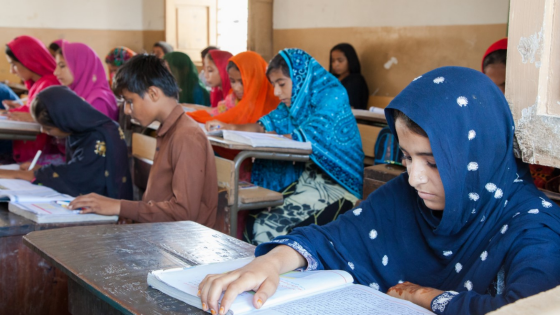 Pakistani students read at their desks