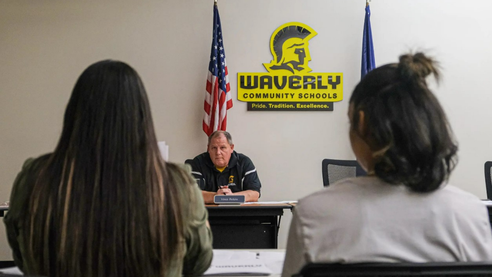 Paloma Sanchez, left, and her daughter Paloma, 13, listen to Waverly School Board Member Vince Perkins at a meeting