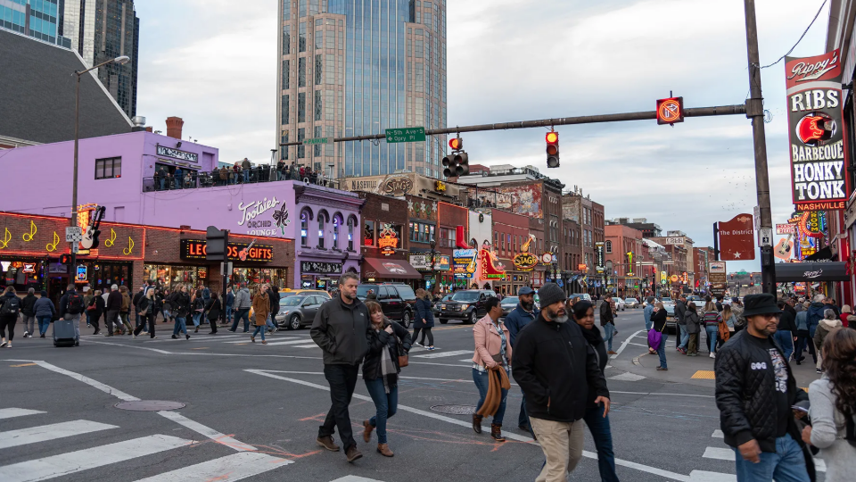 Pedestrians crossing busy street in Nashville