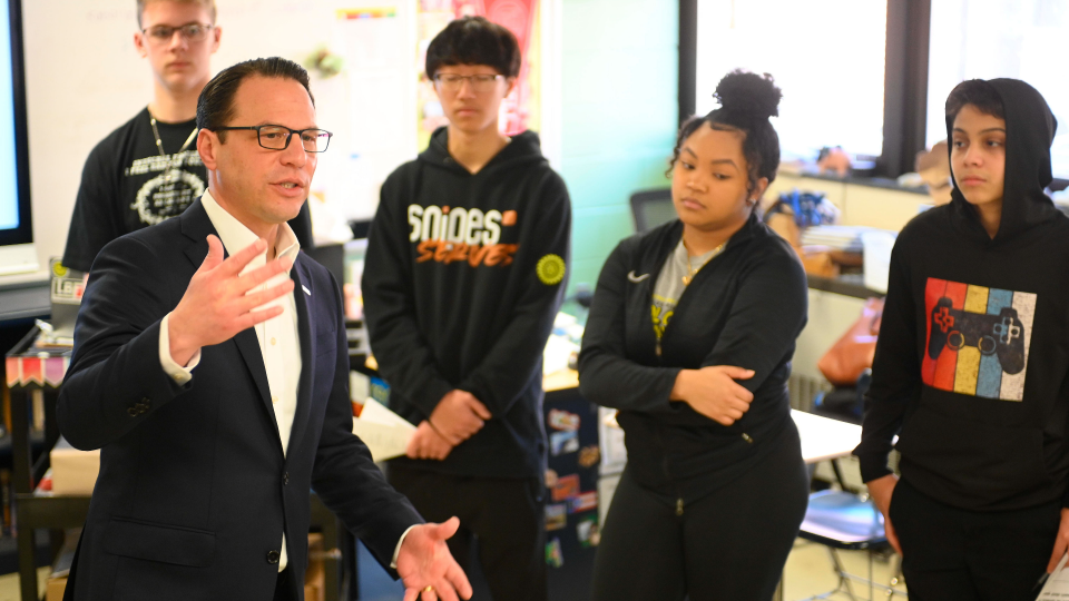 Pennsylvania Governor Josh Shapiro speaks to students in a classroom during a visit to G.W. Carver High School of Engineering and Science in North Philadelphia