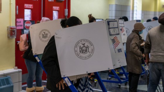 People cast their vote for the 2020 U.S Presidential Election at a polling site in Manhattan.