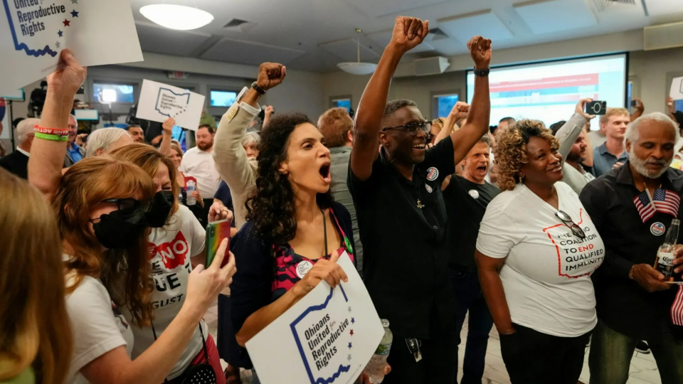 People celebrate the defeat of Issue 1, a measure that would have made it harder to amend the state constitution, in Columbus