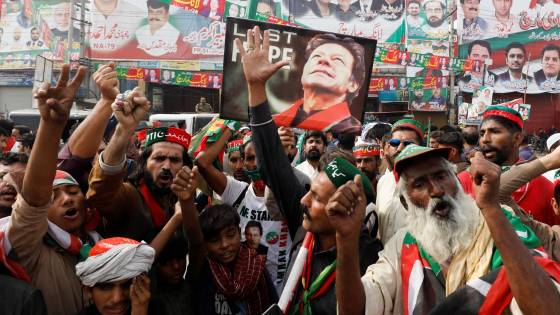 People chant slogans as they condemn the shooting incident on a long march held by Pakistans former Prime Minister Imran Khan