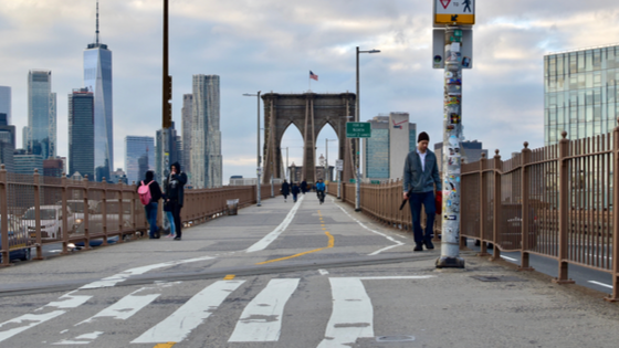 People crossing bridge in NYC