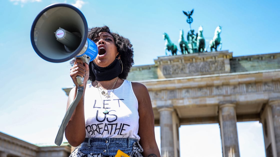 People demonstrate in commemoration of George Floyd near the American embassy at Pariser Platz in Berlin