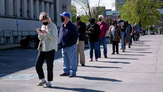 People line up outside a newly reopened career center for in-person appointments in Louisville