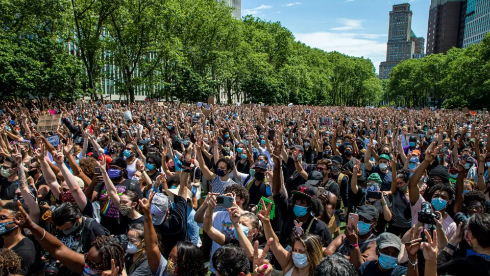 People participate in a peaceful memorial for George Floyd at Cadman Plaza Park in Brooklyn, New York