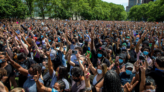 People participate in a peaceful memorial for George Floyd at Cadman Plaza Park in Brooklyn