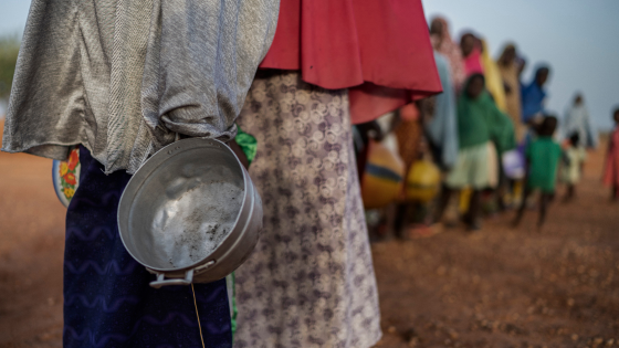 People waiting in line for water