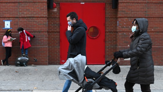 People walk past the entrance of PS 234 Independence School